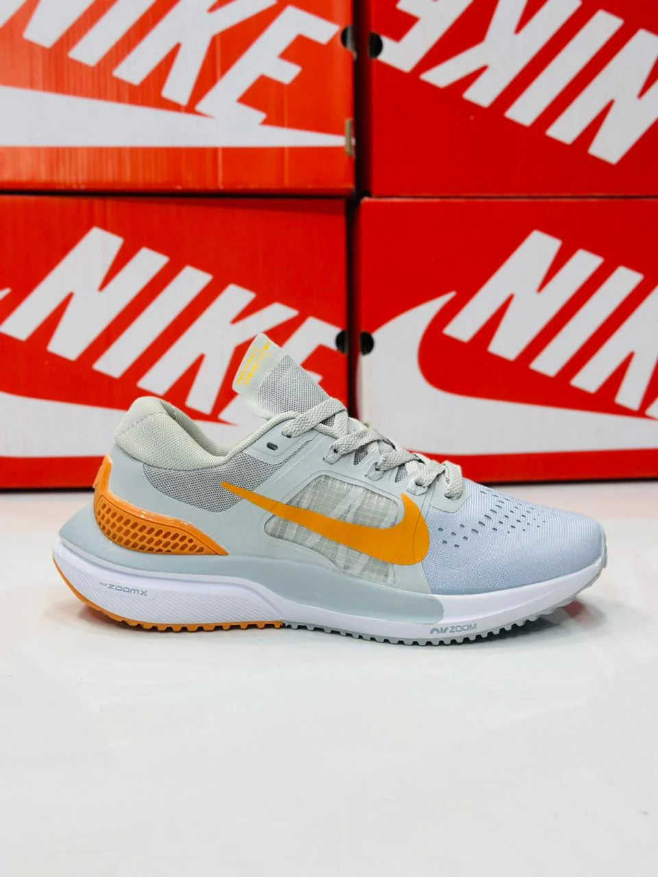 NIKE AIR ZOOM VOMERO 15 MULTI GREY AND ORANGE